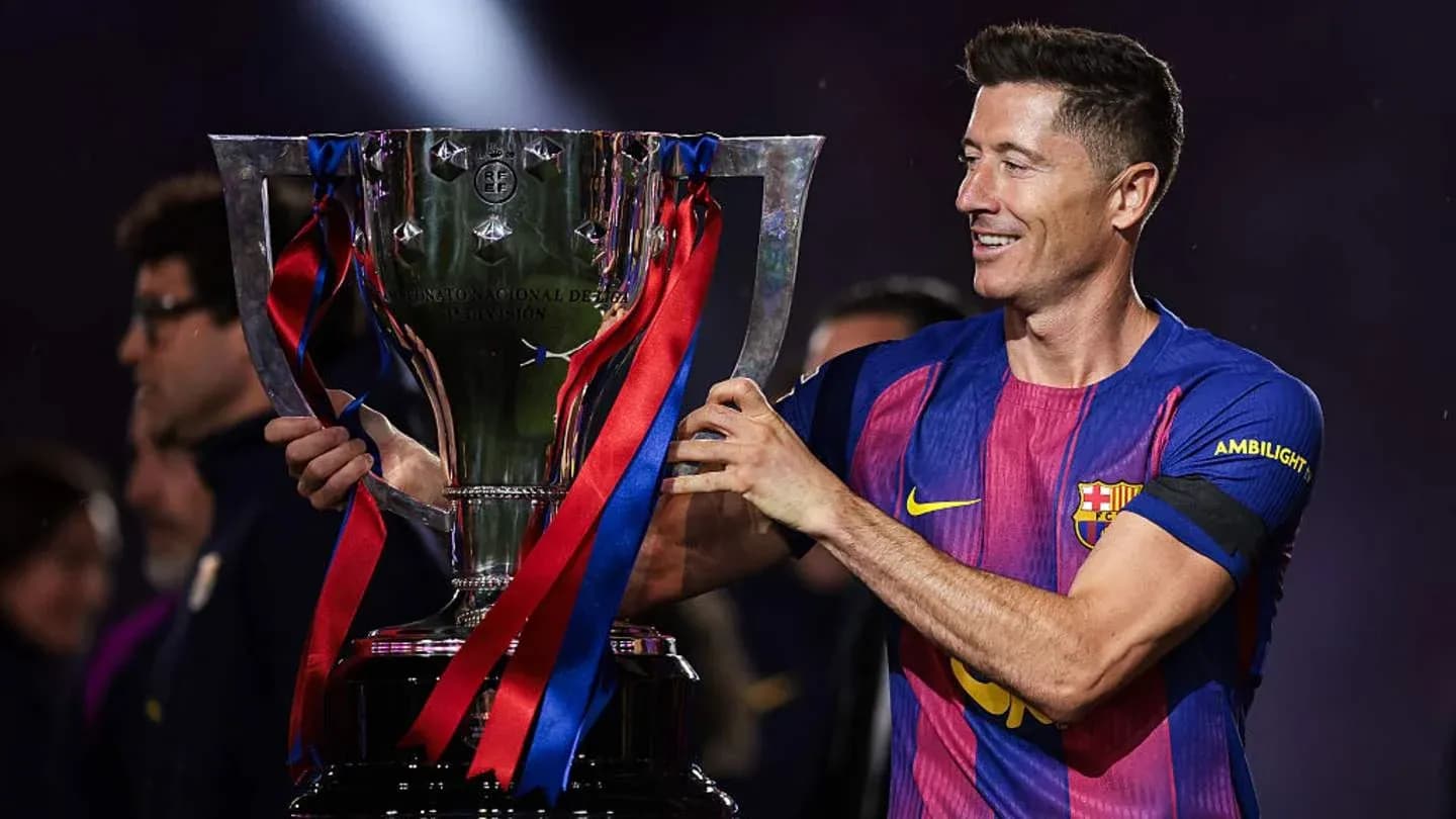 Player holding trophy after match celebration