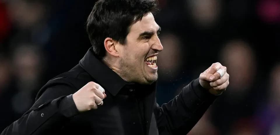 Coach celebrating passionately during match