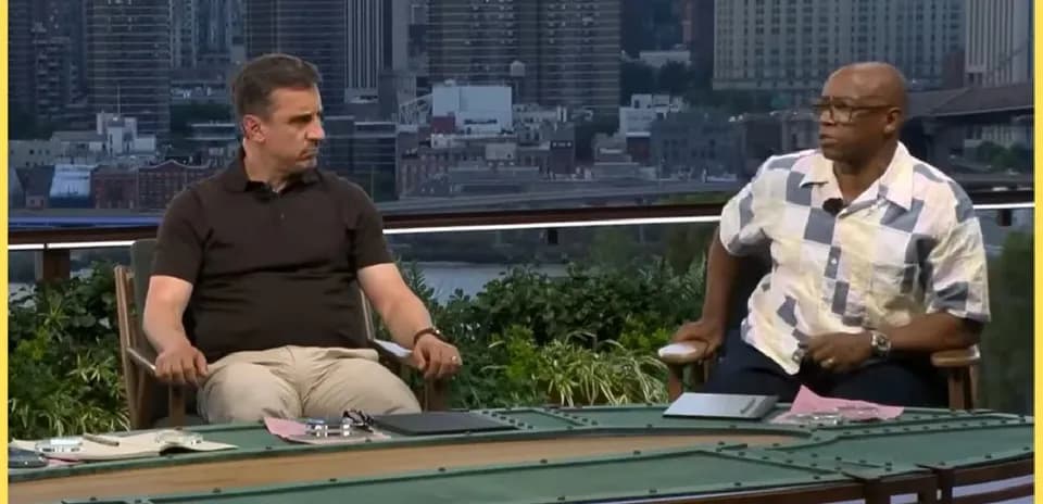 Two sports analysts seated at a discussion table