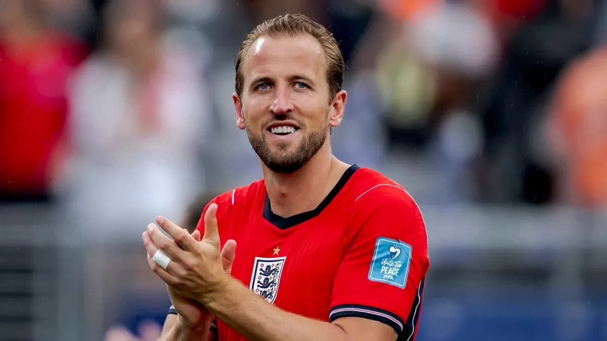 Player applauding in red jersey during match