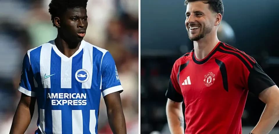 Two football players in team kits on display