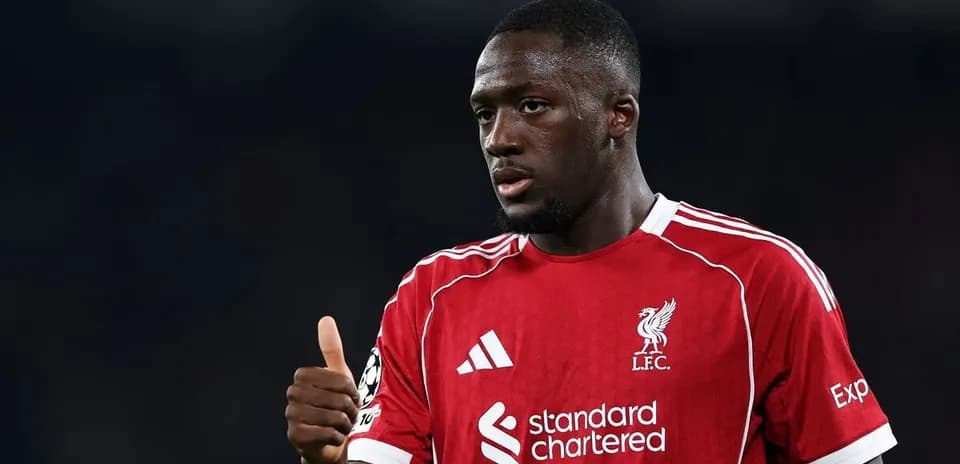 Player in Liverpool jersey giving a thumbs up