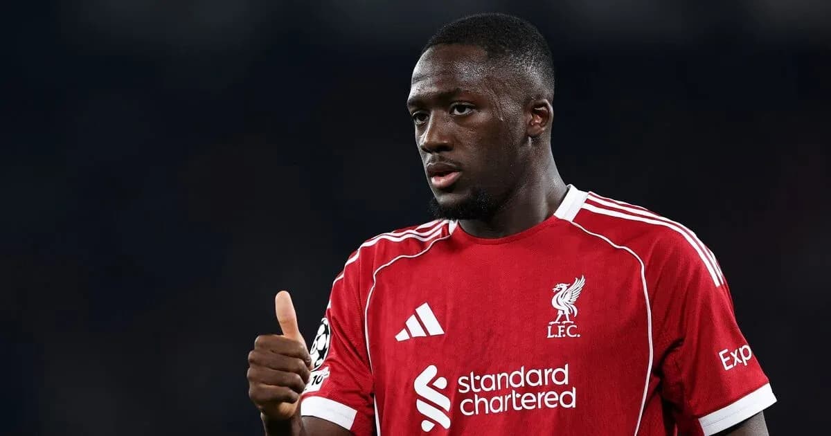 Player in Liverpool jersey giving a thumbs up