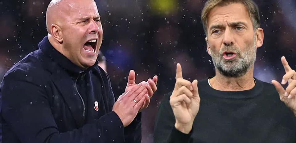 Two football managers gesturing during a match