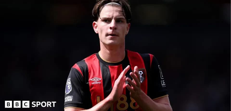 Bournemouth player applauding fans on the pitch