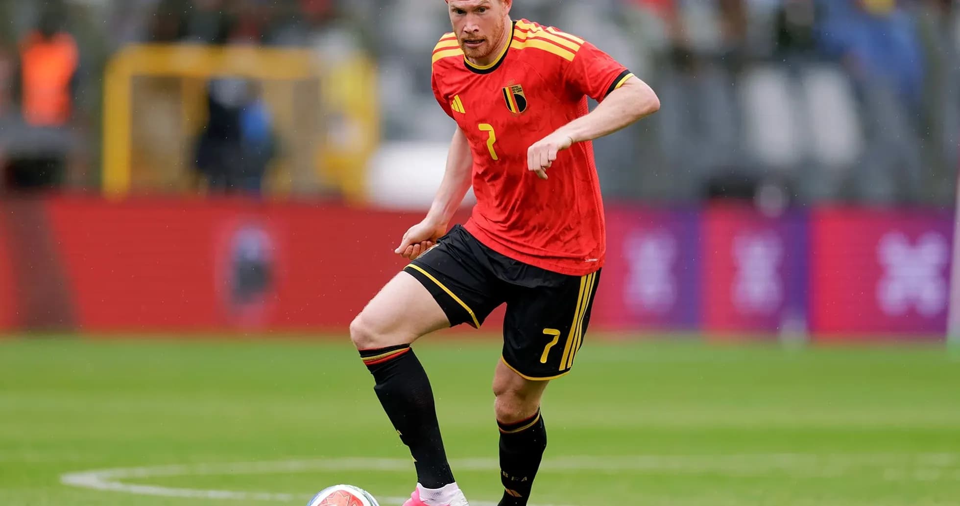 Belgian player dribbling ball during match