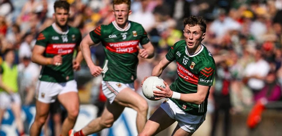 Mayo player running with the ball during a match