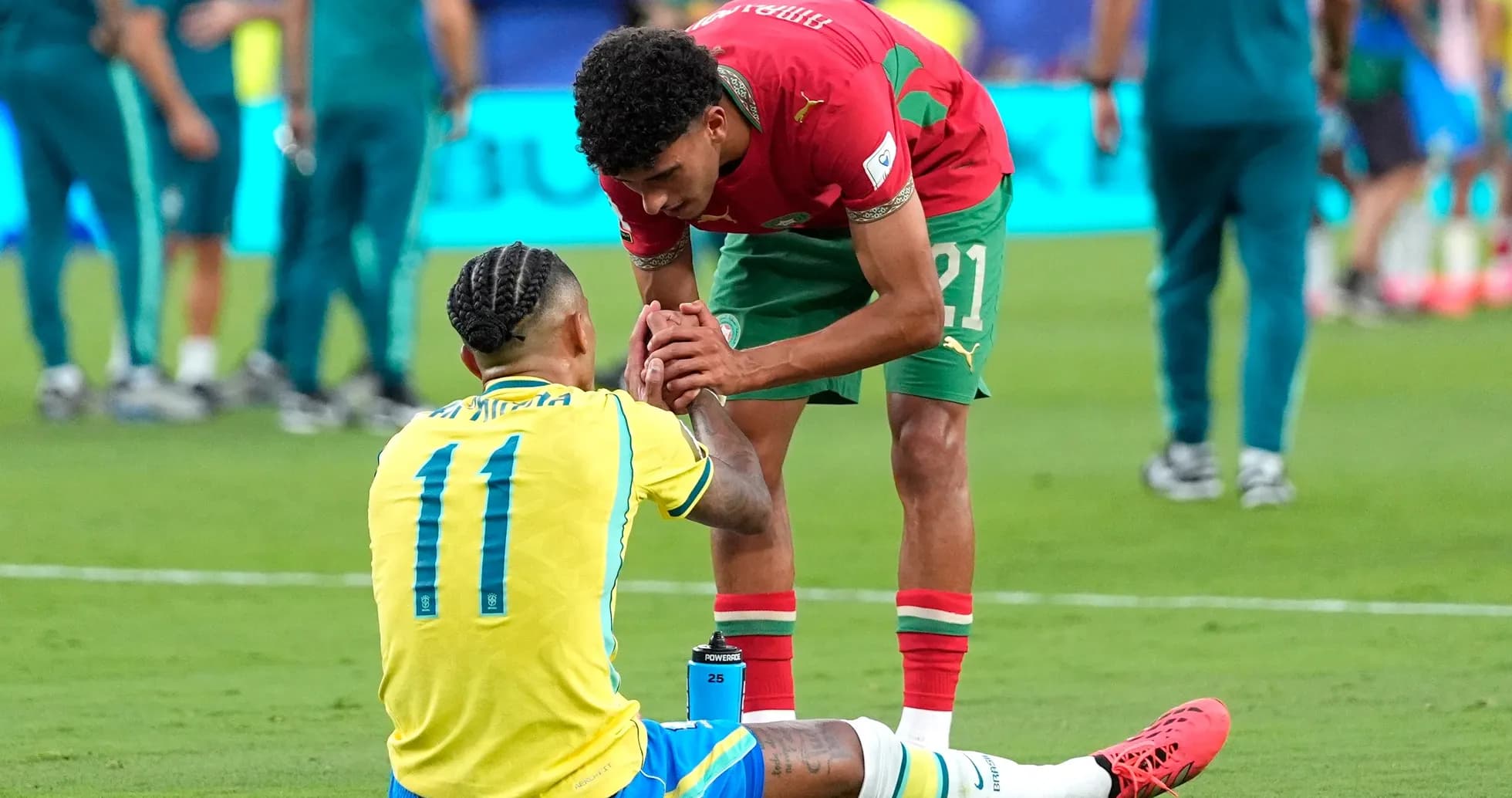 Players from Brazil and Morocco interacting on field