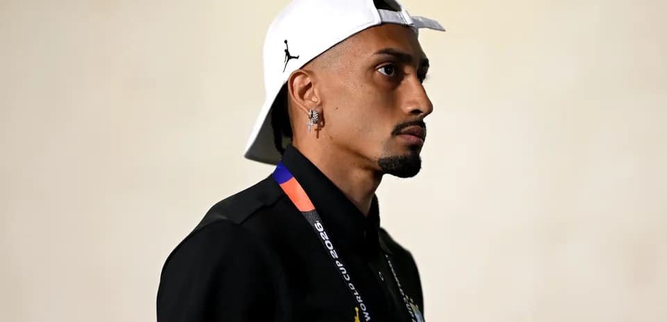 Individual wearing a cap and FIFA World Cup lanyard