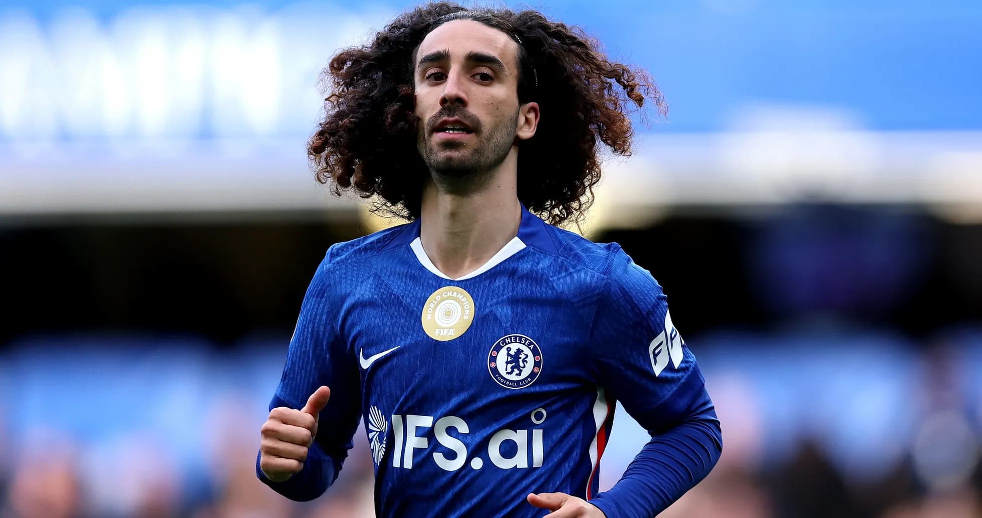 Player running in Chelsea jersey during match