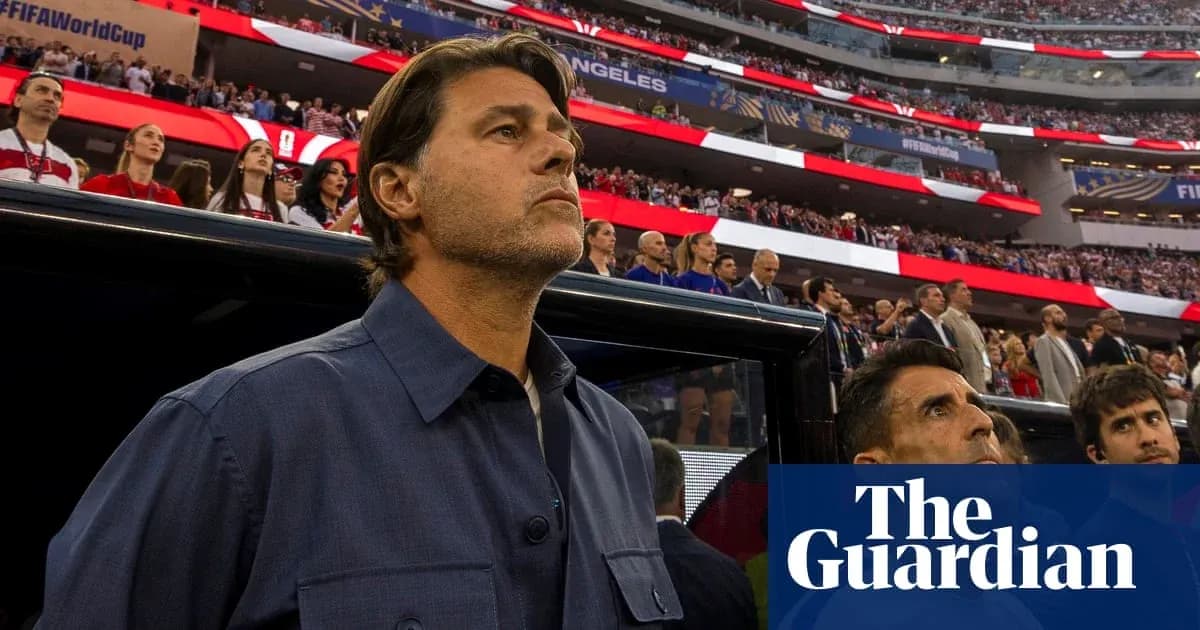 Coach observing players during national anthem at stadium