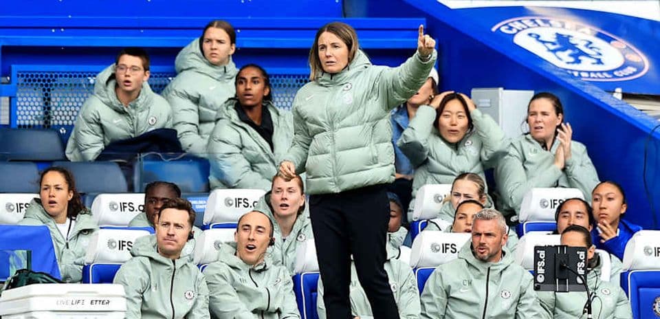 Coach giving instructions to players on the bench