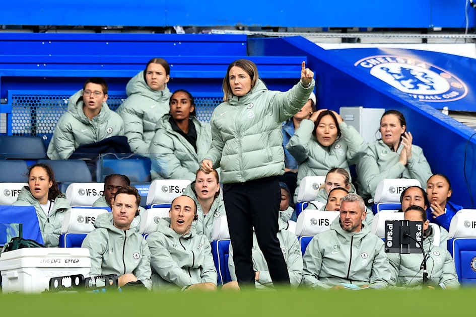 Coach giving instructions to players on the bench