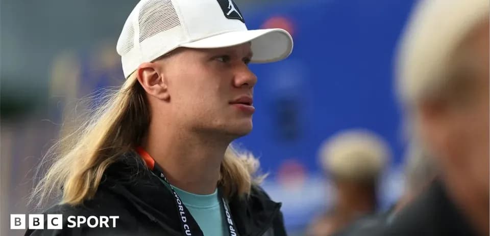 Young man with long hair wearing a white cap