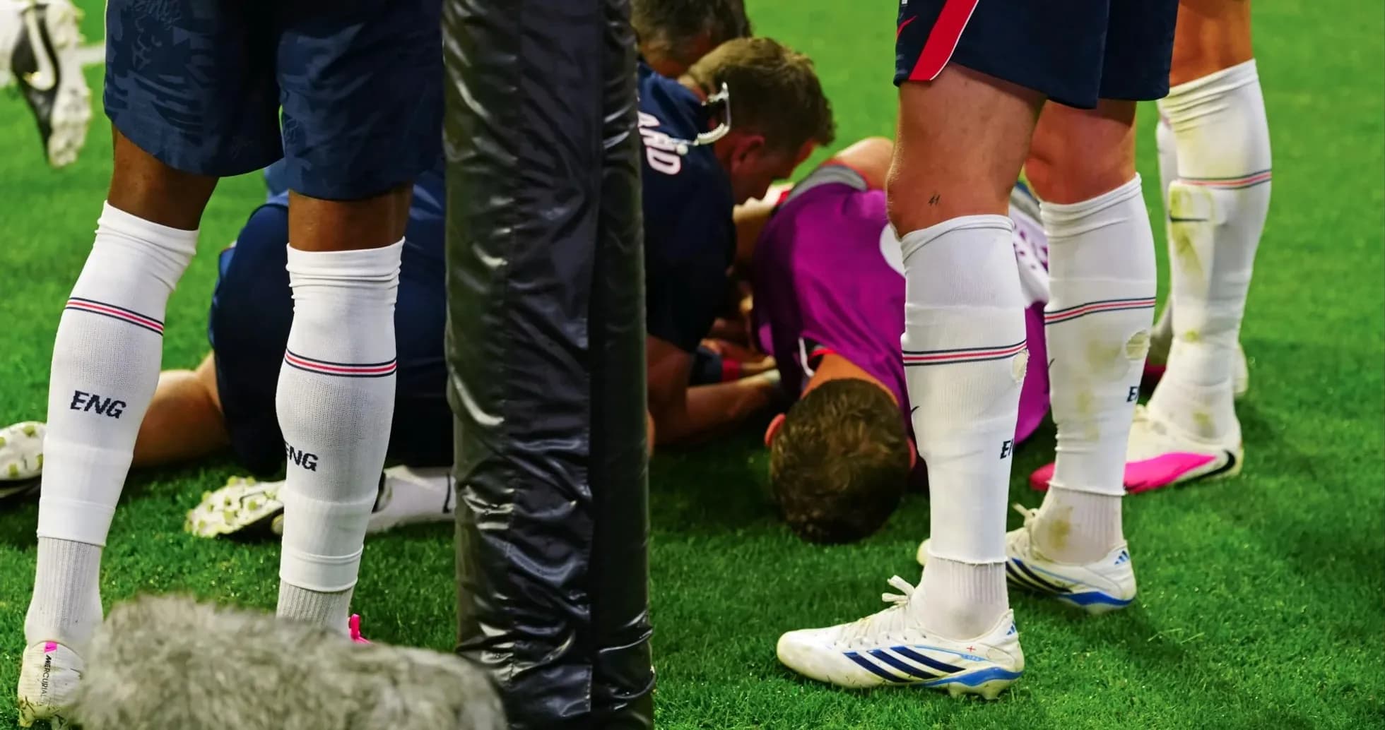 Players attending to injured teammate on field