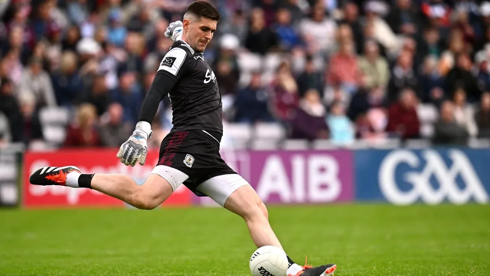 Goalkeeper taking a kick during a match