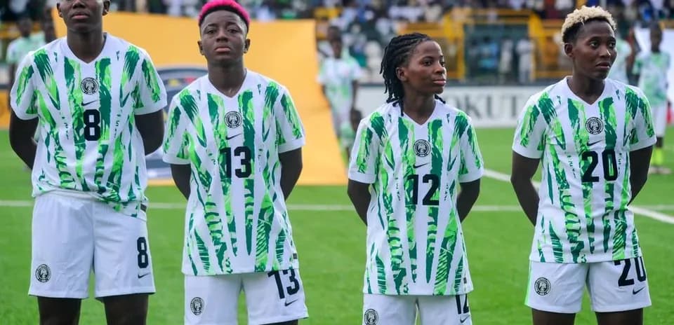 Four Nigerian players standing in uniform before match