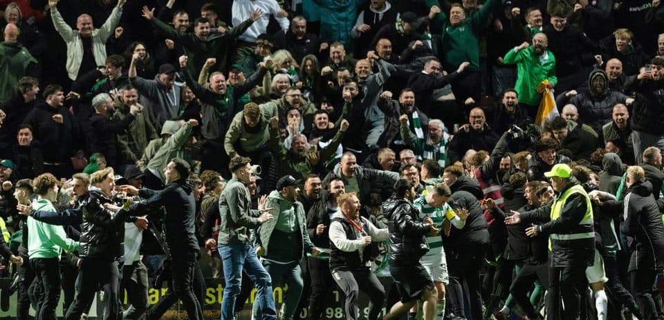 Crowd celebrating passionately after a match