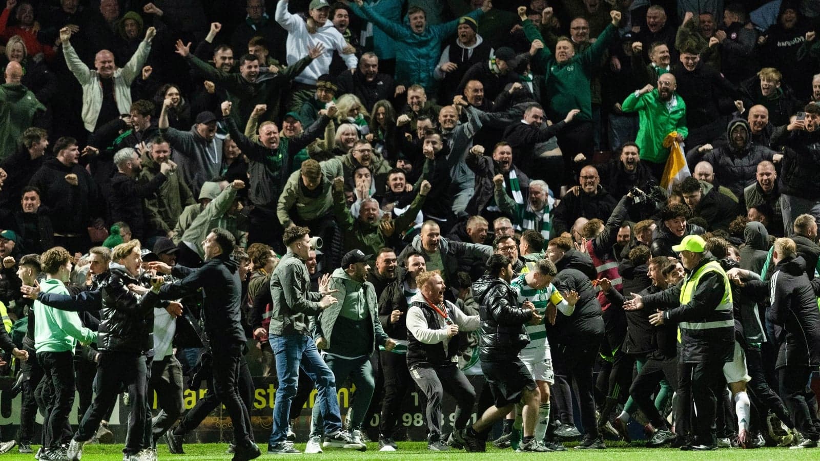 Crowd celebrating passionately after a match
