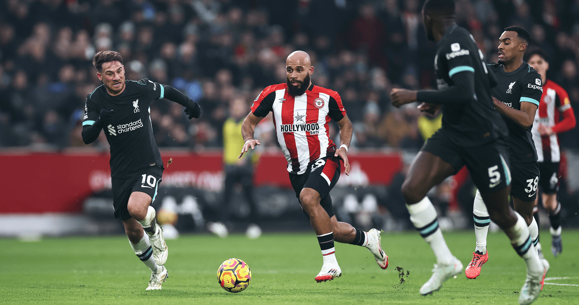 Liverpool player chasing ball against Brentford