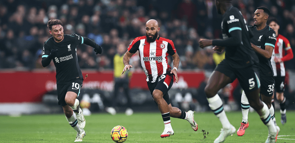 Liverpool player chasing ball against Brentford