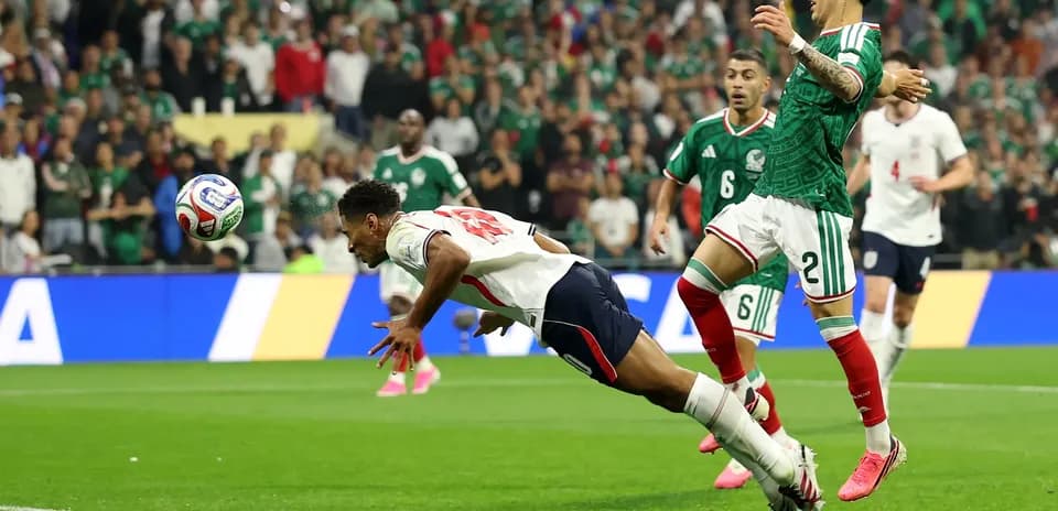 Player diving for the ball during Mexico vs England