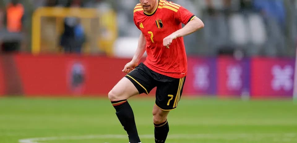 Belgian player dribbling the ball on field