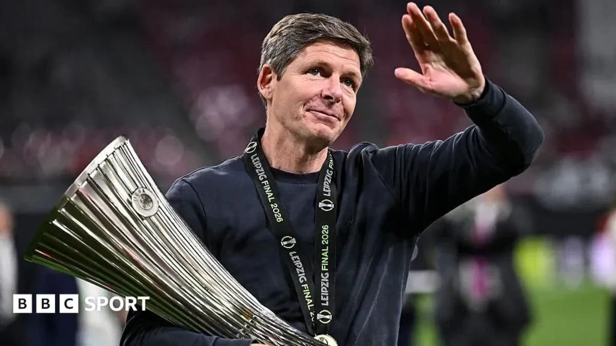 Coach celebrating with trophy at Leipzig Final 2026
