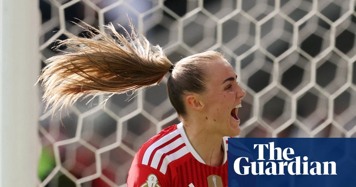 Goalkeeper celebrating a save in front of net