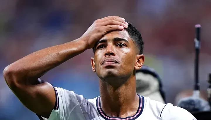 Player holding head in distress during match