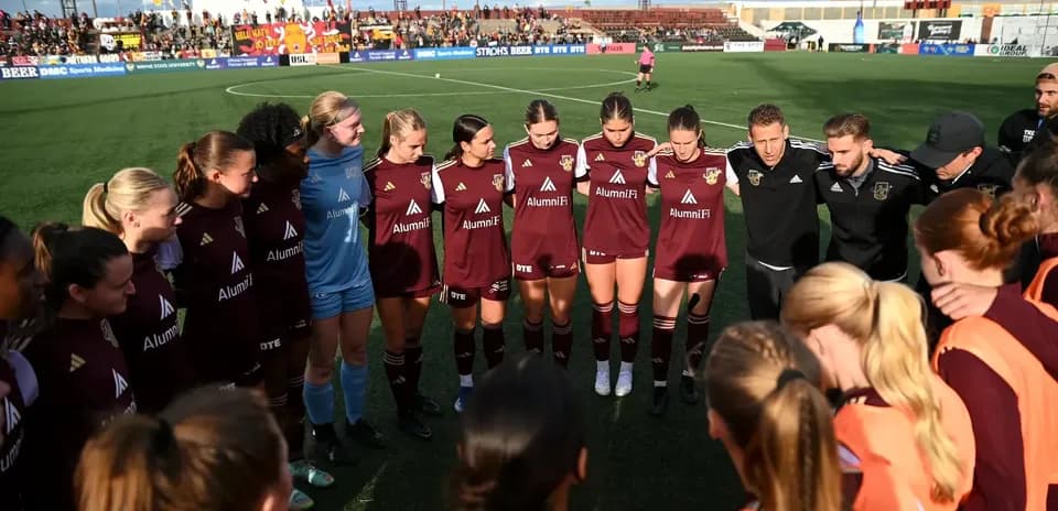 Detroit City players in huddle before match
