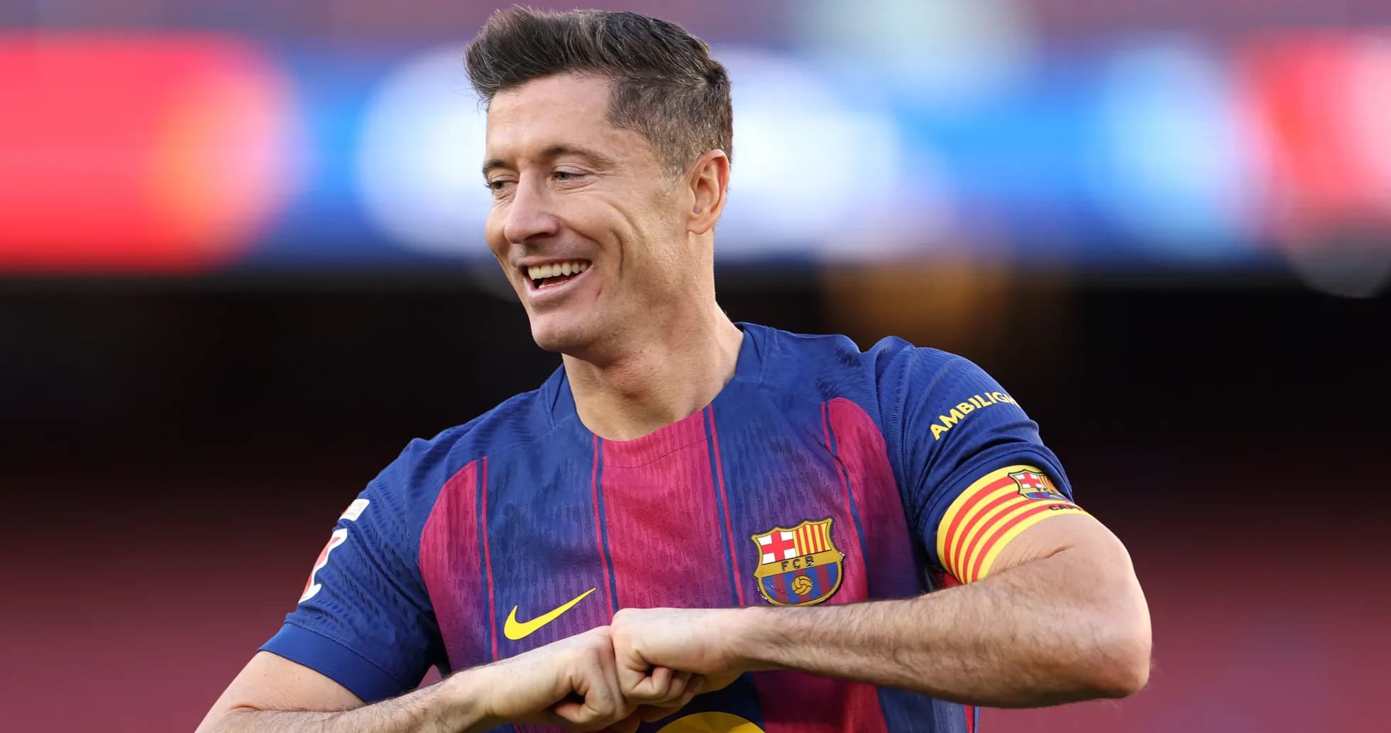 Player smiling while wearing FC Barcelona jersey