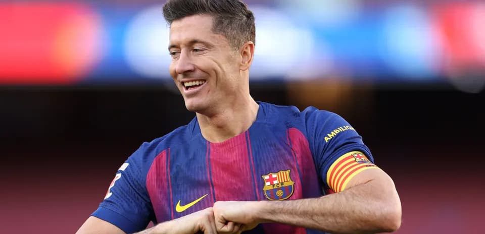 Player smiling while wearing FC Barcelona jersey