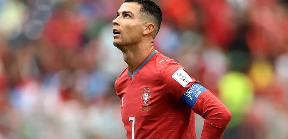 Player looking up during a match in red jersey
