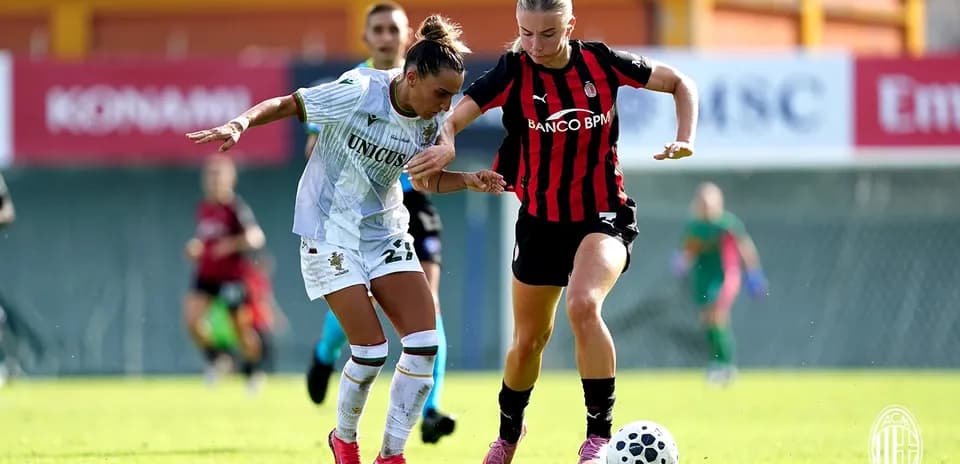 Two players competing for the ball during match