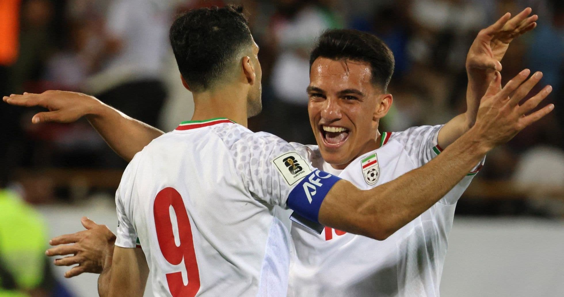Players celebrating a goal during a match