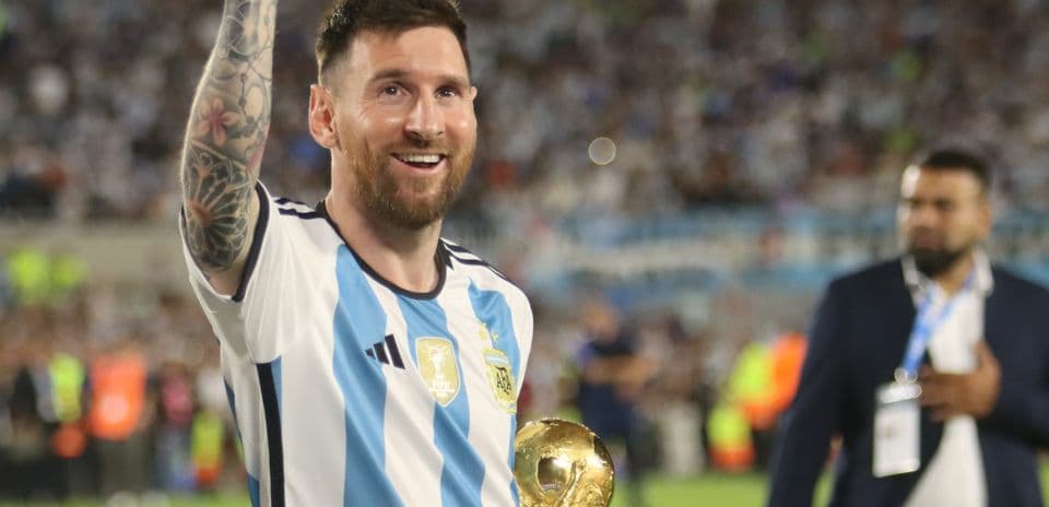 Player celebrating with trophy after winning match