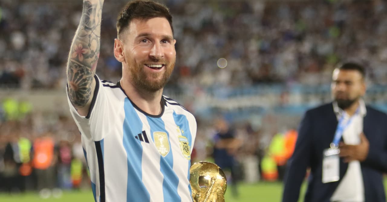Player celebrating with trophy after winning match