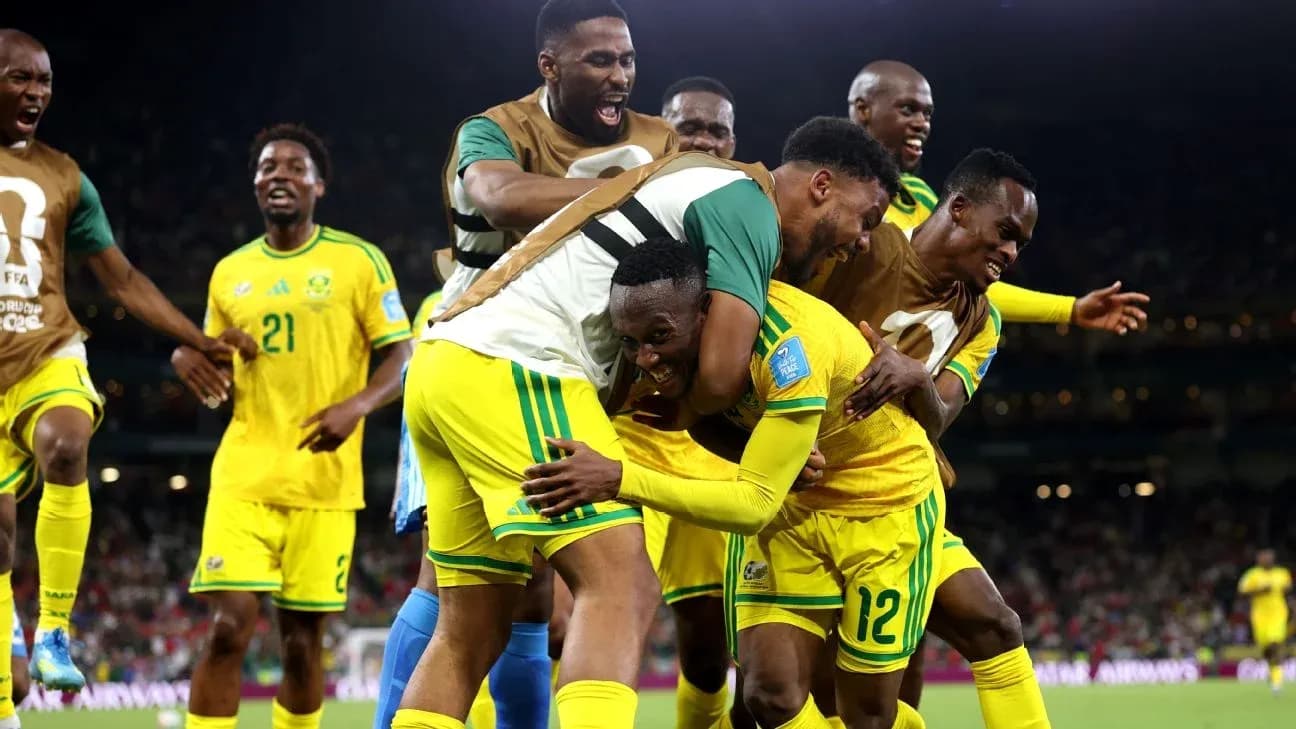 Players celebrating a goal during a football match