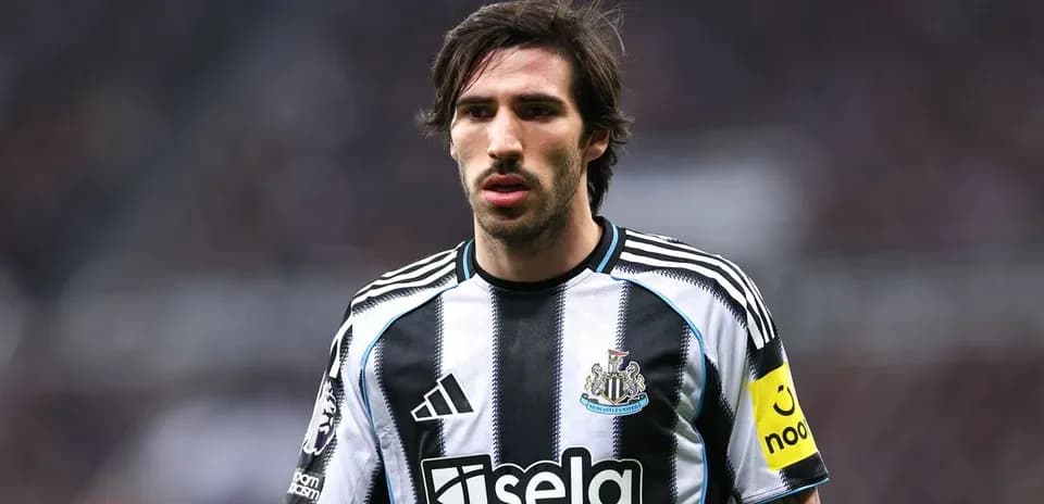 Newcastle player wearing captain's armband on pitch