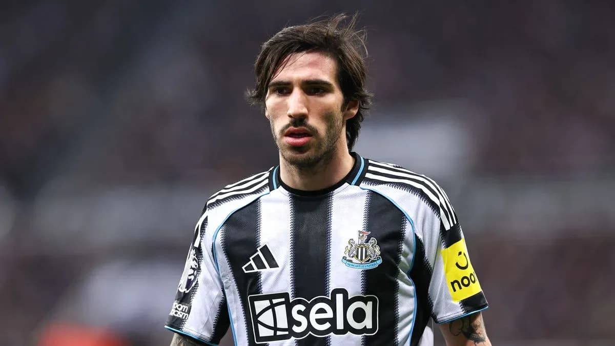 Newcastle player wearing captain's armband on pitch