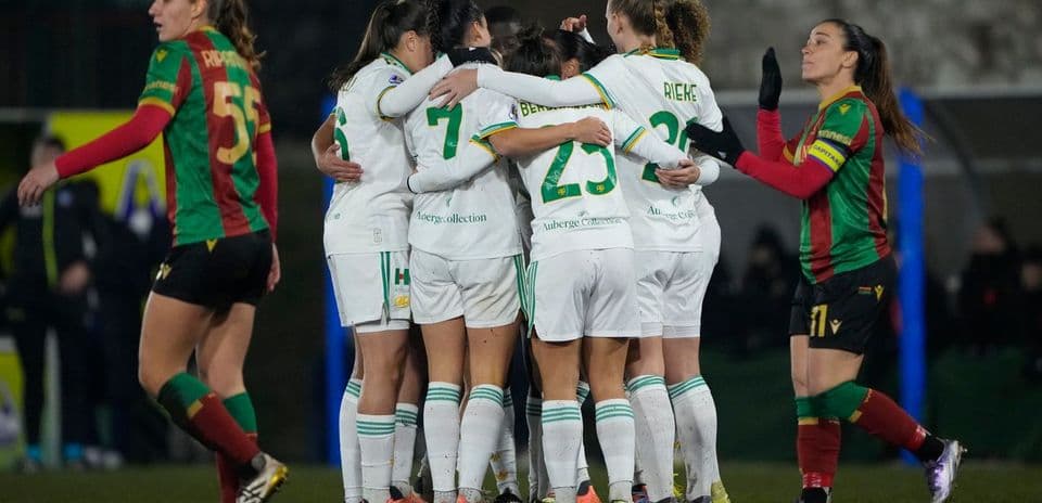Players celebrating a goal during match