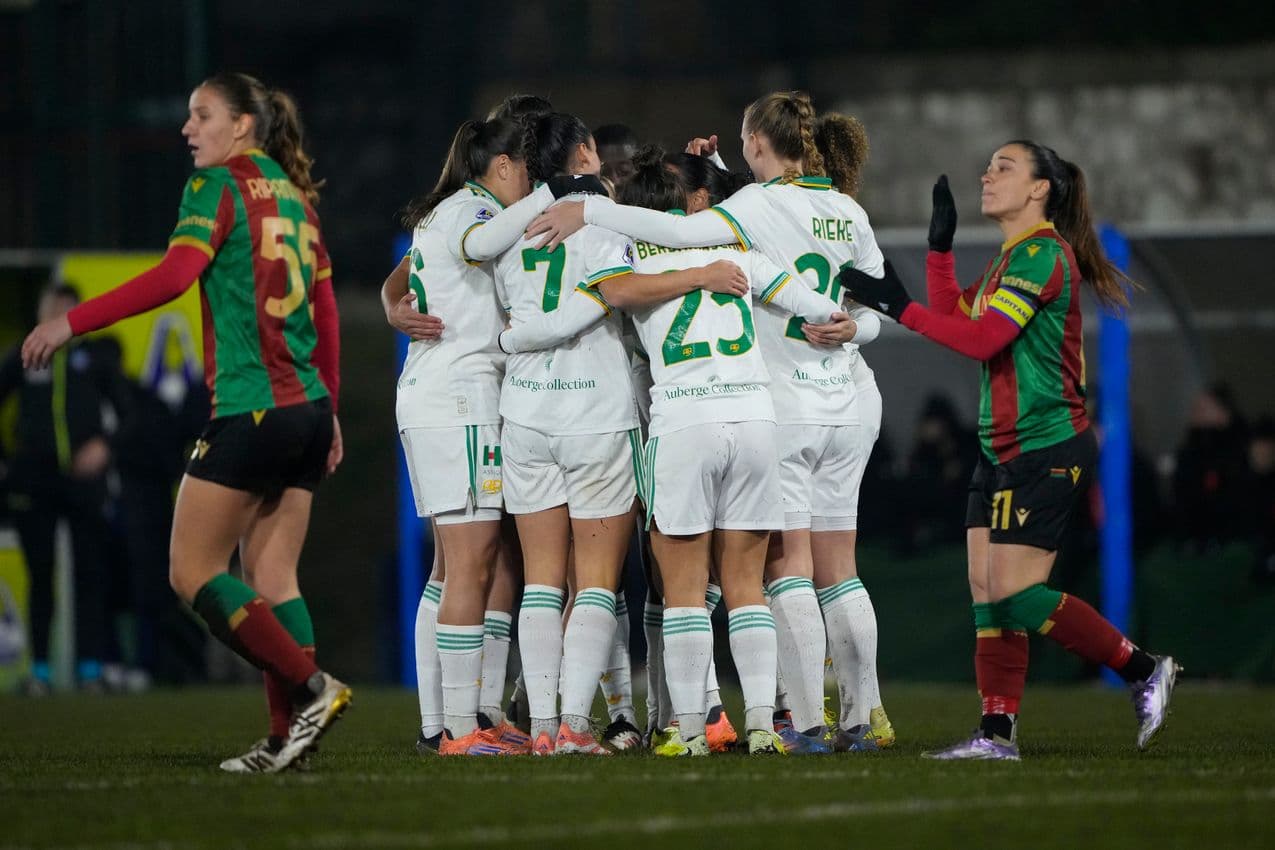 Players celebrating a goal during match