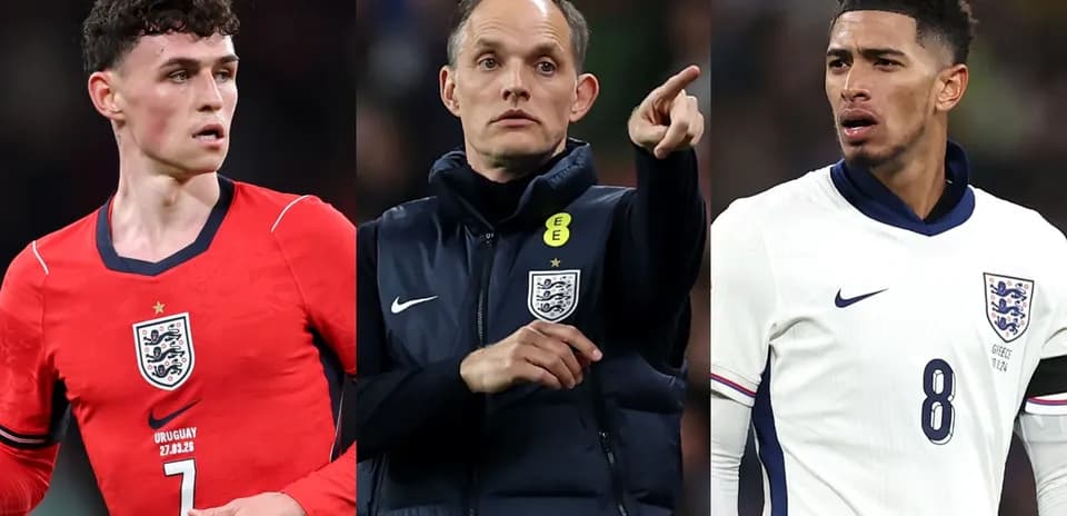Three football players in England jerseys during match