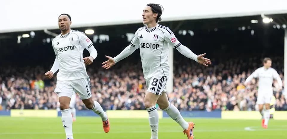 Fulham players celebrating a goal during a match