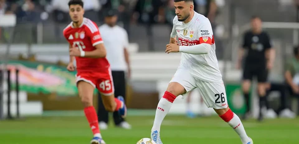 Player dribbling ball during a soccer match