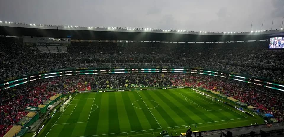 Empty stadium before a match with fans arriving