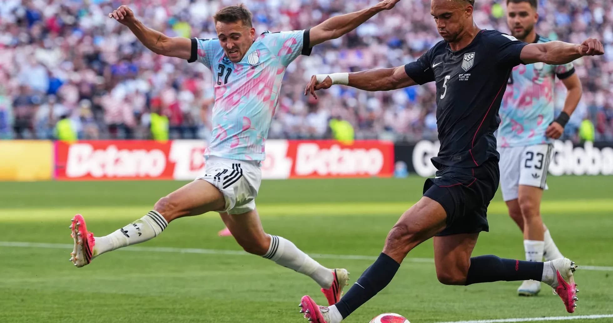 USA player kicking the ball against Belgium