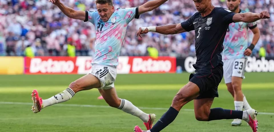 USA player kicking the ball against Belgium
