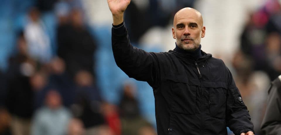 Manager waving to fans during match at stadium